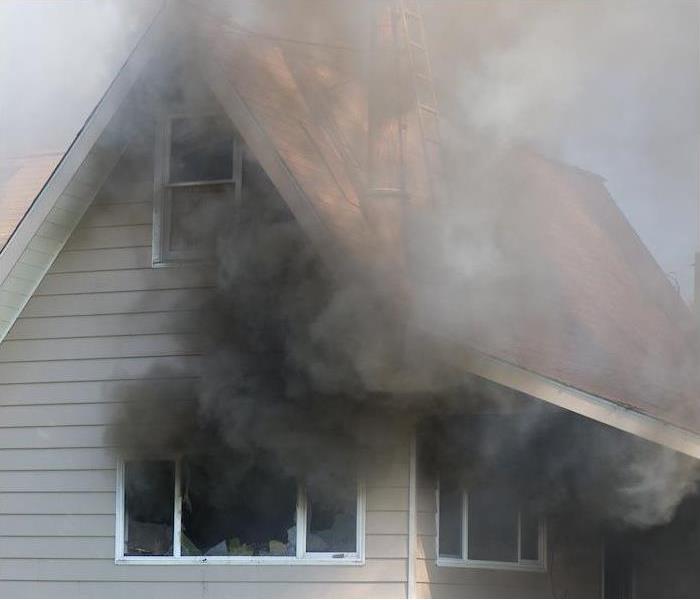 Smoke from a fire inside of a house