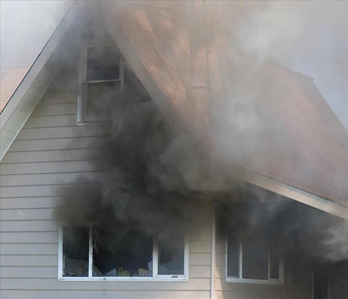 smoke emerging from a house fire